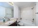Updated bathroom with large mirror, modern fixtures, and tub with shower at 1729 Seascape Cir # 102, Tarpon Springs, FL 34689
