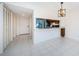 Dining room features tile floors, a modern light fixture and a pass-through to the kitchen at 1729 Seascape Cir # 102, Tarpon Springs, FL 34689