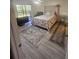 Cozy main bedroom with a large bed, accent rugs, and a view of the outdoors at 1729 Seascape Cir # 102, Tarpon Springs, FL 34689
