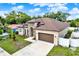 Aerial view showcasing the home's roof, well-manicured lawn, and proximity to neighboring properties at 17838 Morninghigh Dr, Lutz, FL 33549