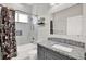 Full bathroom features combination shower and tub, granite vanity top, and neutral tiling at 17838 Morninghigh Dr, Lutz, FL 33549
