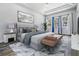 This is a main bedroom with a luxury bed and stylish decor, with windows to allow natural light in at 17838 Morninghigh Dr, Lutz, FL 33549