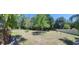 Expansive backyard with lush greenery and a well-maintained lawn at 18434 Eastwyck Dr, Tampa, FL 33647