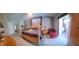 Primary bedroom suite with a four-poster bed, ensuite bathroom, and sliding glass doors to the lanai at 18434 Eastwyck Dr, Tampa, FL 33647