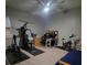 Multi-purpose bedroom including exercise equipment and a work-space at 18434 Eastwyck Dr, Tampa, FL 33647
