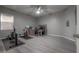 Bright exercise room with wood floors, a ceiling fan, and lots of space at 18434 Eastwyck Dr, Tampa, FL 33647