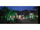 Beautiful two-story home with landscape lighting enhancing the curb appeal at twilight at 18434 Eastwyck Dr, Tampa, FL 33647