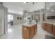 Bright kitchen with an island offering storage and prep space; open to dining area at 18434 Eastwyck Dr, Tampa, FL 33647