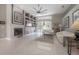 Spacious living room featuring a fireplace, built-in shelving, and sliding glass doors to the outdoor area at 18434 Eastwyck Dr, Tampa, FL 33647