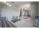 Elegant living room with tile floors and views into the dining area, perfect for entertaining and relaxing at 18434 Eastwyck Dr, Tampa, FL 33647