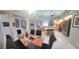 Spacious open-concept living area with a dining table, kitchen island, and stainless steel appliances at 18434 Eastwyck Dr, Tampa, FL 33647