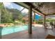 A screened-in pool with a waterfall, and a hot tub at 18434 Eastwyck Dr, Tampa, FL 33647