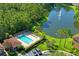 Aerial view of the community pool, lake with fountain, and surrounding landscaping at 18809 Duquesne Dr, Tampa, FL 33647