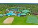 Aerial view of a community center with a pool, courts, recreational areas, and well-maintained grounds at 18809 Duquesne Dr, Tampa, FL 33647