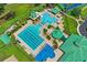 An aerial view of a community pool area with multiple pools, a slide, and many recreational amenities at 18809 Duquesne Dr, Tampa, FL 33647
