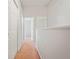 Bright hallway with multiple doors, natural light, and carpeted floor at 18809 Duquesne Dr, Tampa, FL 33647