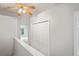 Upper hallway featuring plenty of storage and natural light at 18809 Duquesne Dr, Tampa, FL 33647