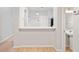 Cozy kitchen featuring a bar and a view of the sink and bathroom at 18809 Duquesne Dr, Tampa, FL 33647
