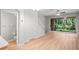 Open concept living room with hardwood floors, staircase and access to the patio at 18809 Duquesne Dr, Tampa, FL 33647