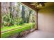 Screened patio with an open view of lush, green backyard at 18809 Duquesne Dr, Tampa, FL 33647