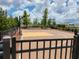 Well-maintained community basketball court with benches surrounded by landscaping at 1905 Blue Stream St, Ruskin, FL 33570