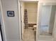 Bathroom featuring a shower/tub combo, patterned curtain, and view to bedroom at 1905 Blue Stream St, Ruskin, FL 33570