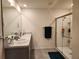 Bright bathroom features double sinks, granite countertop, and a glass-enclosed shower at 1905 Blue Stream St, Ruskin, FL 33570