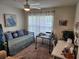 Cozy bedroom with a daybed, window with sheer curtains, and a desk area for work or hobbies at 1905 Blue Stream St, Ruskin, FL 33570