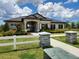 Beautiful community clubhouse, complemented by landscaping and charming stone accents at 1905 Blue Stream St, Ruskin, FL 33570