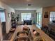 Dining room features a dining table and chairs, complemented by natural light at 1905 Blue Stream St, Ruskin, FL 33570