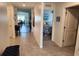 Hallway with views of the dining room, living room, and bedroom; tile flooring and light walls at 1905 Blue Stream St, Ruskin, FL 33570