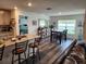 Updated kitchen with a granite island, stainless appliances, and an adjacent dining area at 1905 Blue Stream St, Ruskin, FL 33570