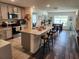 Spacious kitchen with a large island, granite countertops, and stainless steel appliances at 1905 Blue Stream St, Ruskin, FL 33570