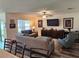 Comfortable living room featuring modern furnishings and a large flat-screen TV at 1905 Blue Stream St, Ruskin, FL 33570
