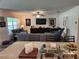 Open-concept living room features stylish furnishings, modern decor, and a ceiling fan at 1905 Blue Stream St, Ruskin, FL 33570