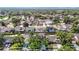 Aerial view showcasing the neighborhood with multiple homes and pools at 1906 White Cedar Way, Brandon, FL 33511