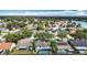 Expansive aerial view showcasing the neighborhood and nearby lake at 1906 White Cedar Way, Brandon, FL 33511