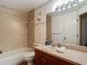 Bathroom with vanity, mirror, and tiled shower/tub combination at 1906 White Cedar Way, Brandon, FL 33511