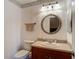 Bathroom with countertop sink and mirror, towel and wallpaper at 1906 White Cedar Way, Brandon, FL 33511