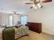 Bright bedroom with a ceiling fan and a view of the en suite bathroom at 1906 White Cedar Way, Brandon, FL 33511