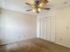 Comfortable bedroom with neutral carpeting, ceiling fan and closet at 1906 White Cedar Way, Brandon, FL 33511