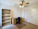 Bedroom with ceiling fan, closet, desk and shelving at 1906 White Cedar Way, Brandon, FL 33511