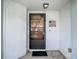 Exterior view of a front door with welcome decor at 1906 White Cedar Way, Brandon, FL 33511