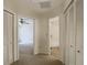 Bright hallway with access to bedroom and bathroom, with large closets for storage at 1906 White Cedar Way, Brandon, FL 33511