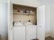 Laundry closet with white washer and dryer at 1906 White Cedar Way, Brandon, FL 33511
