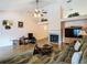 Comfortable living room featuring a fireplace and vaulted ceiling with a ceiling fan at 1906 White Cedar Way, Brandon, FL 33511