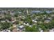 Lakefront community with mature trees, manicured lawns, and sidewalks at 1920 Cherry Ne St, St Petersburg, FL 33704
