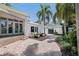 Backyard patio features brick pavers and seating area with lush landscaping at 1920 Cherry Ne St, St Petersburg, FL 33704