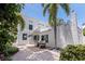 Backyard patio features seating, brick pavers and lush landscaping at 1920 Cherry Ne St, St Petersburg, FL 33704