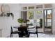 Cozy breakfast nook with modern table and chairs, view of the yard through sliding glass doors at 1920 Cherry Ne St, St Petersburg, FL 33704